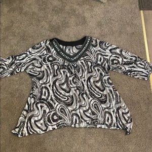 We have this black and white blouse with sparkles